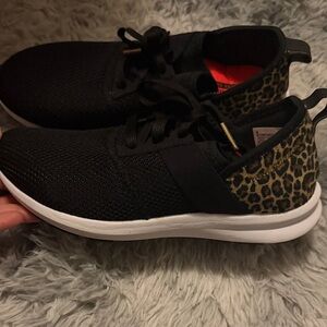 New Balance Black Sneakers with Leopard Heel Accent